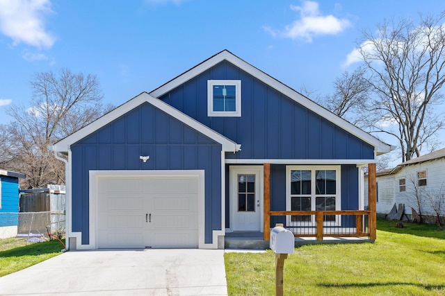 view of front of home with concrete driveway, an attached garage, board and batten siding, a front yard, and fence