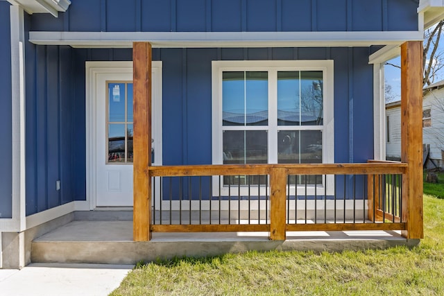 property entrance featuring board and batten siding and a porch