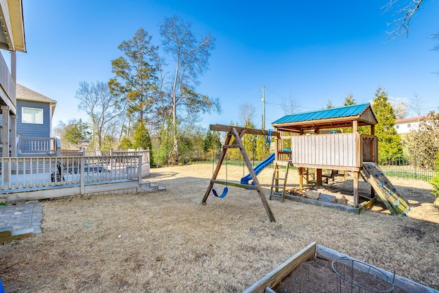 view of playground with a deck