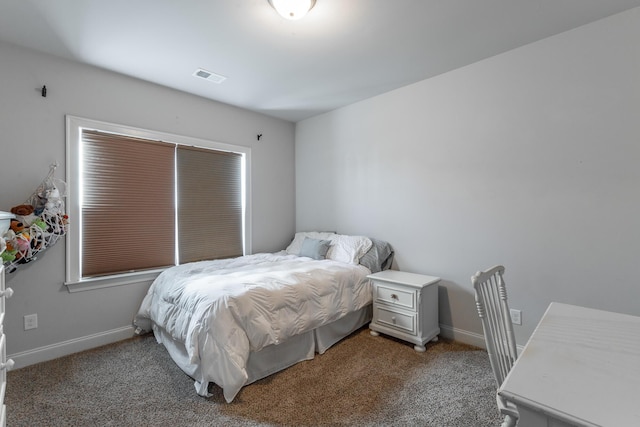 bedroom with visible vents, baseboards, and carpet floors