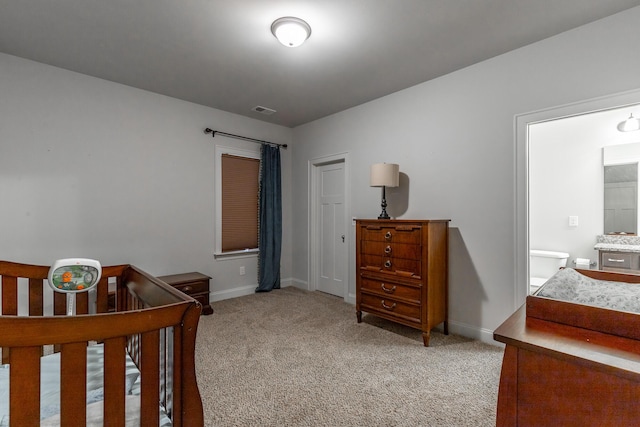 bedroom with baseboards, visible vents, and light carpet