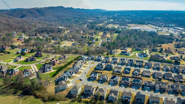 birds eye view of property with a mountain view and a residential view