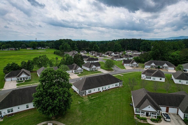 aerial view featuring a residential view and a view of trees