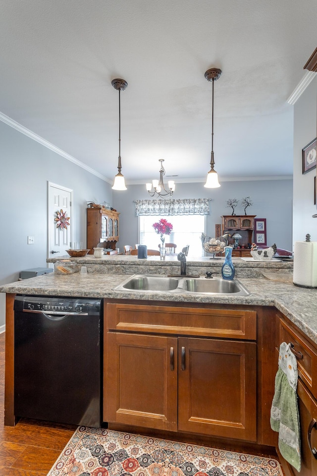 kitchen featuring dishwasher, ornamental molding, a sink, and decorative light fixtures