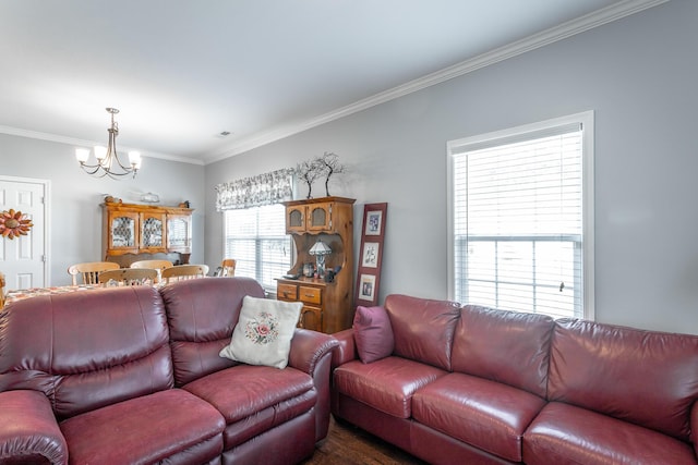 living room with a chandelier and ornamental molding