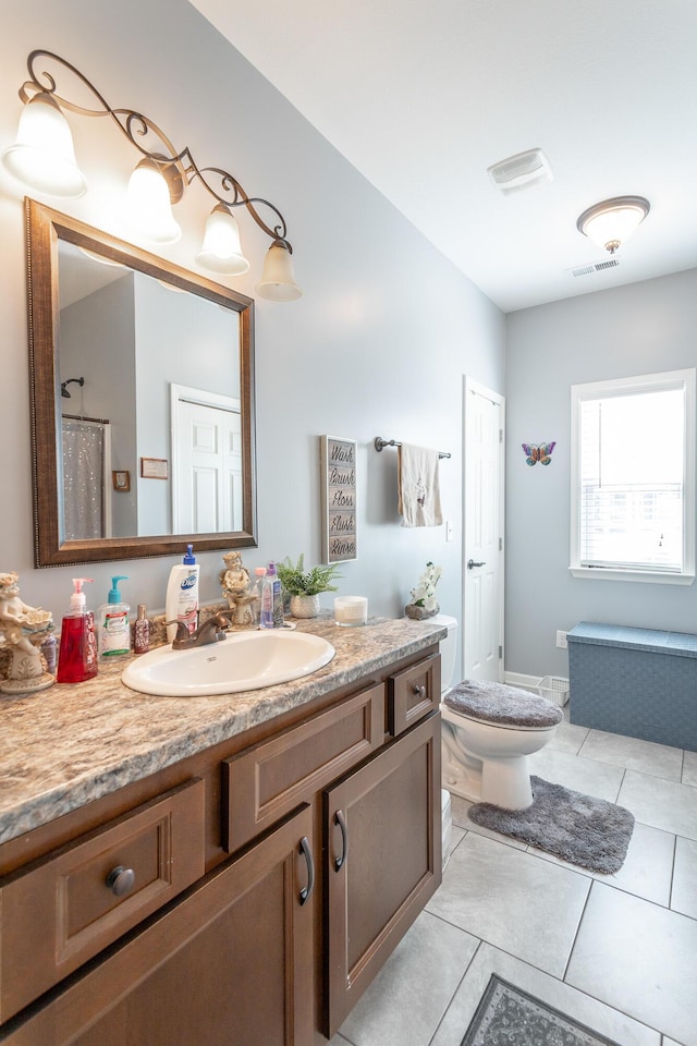 full bathroom with toilet, tile patterned flooring, visible vents, and vanity