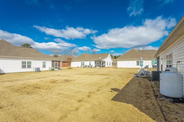 view of yard with central AC