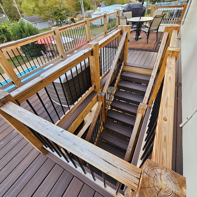 wooden terrace with outdoor dining space