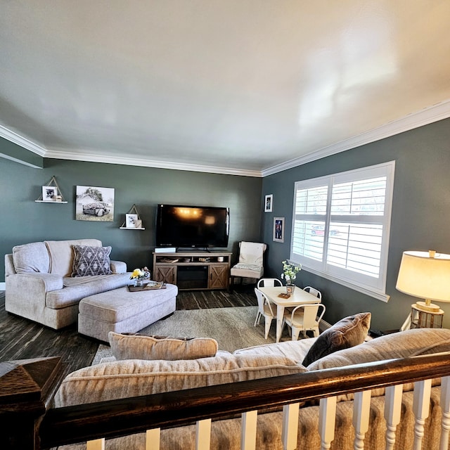 living room with crown molding and wood finished floors