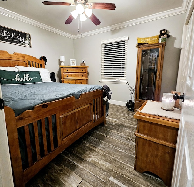 bedroom featuring dark wood finished floors, crown molding, baseboards, and ceiling fan