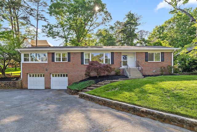 1723 Hixson Pike, Chattanooga, TN 37405 - single story home with brick siding, an attached garage, driveway, and a front lawn