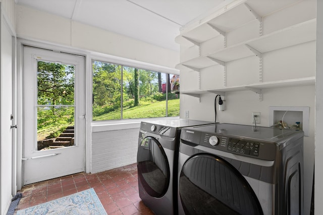 1723 Hixson Pike, Chattanooga, TN 37405 - laundry area featuring a healthy amount of sunlight, dark tile patterned flooring, laundry area, and independent washer and dryer