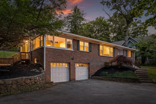 1723 Hixson Pike, Chattanooga, TN 37405 - view of front of property featuring stairs, a garage, driveway, and brick siding