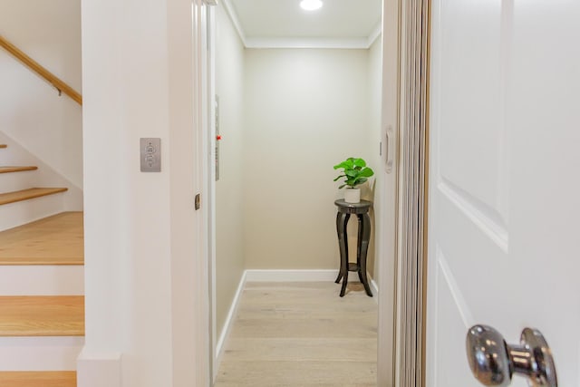 hall featuring stairs, recessed lighting, light wood-type flooring, and baseboards