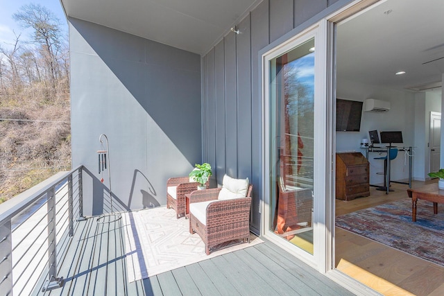 balcony featuring a wall mounted air conditioner