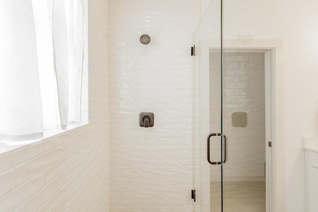 bathroom with a shower stall