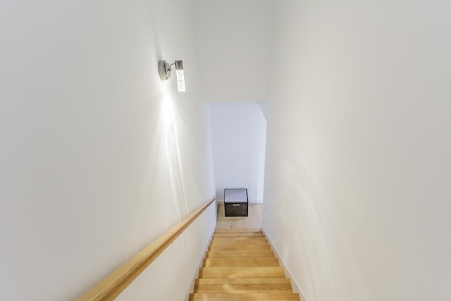 stairway with wood finished floors