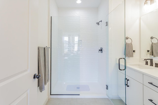 bathroom featuring a stall shower and vanity