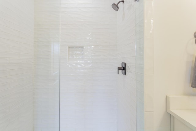 full bath featuring a tile shower