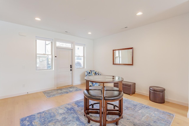 dining room featuring recessed lighting, wood finished floors, visible vents, and baseboards