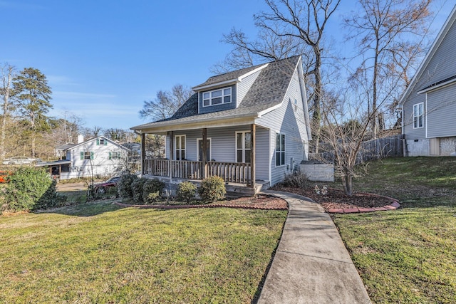 bungalow-style house featuring a front yard, covered porch, and roof with shingles