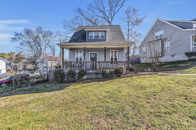 bungalow with covered porch, roof with shingles, and a front yard