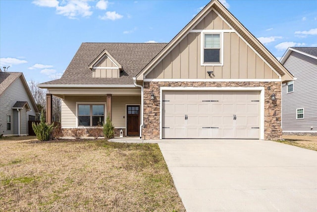 view of front of home featuring board and batten siding, a shingled roof, a front lawn, concrete driveway, and a garage