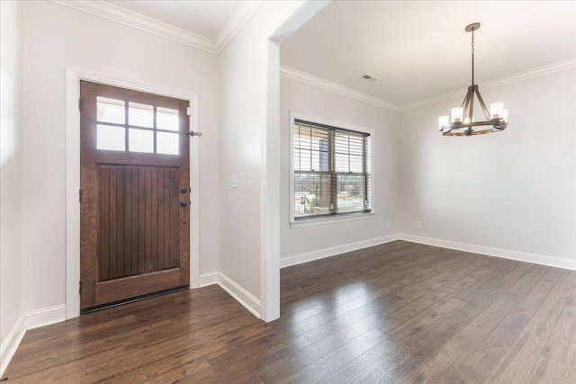 entrance foyer with dark wood-type flooring, visible vents, a chandelier, and ornamental molding