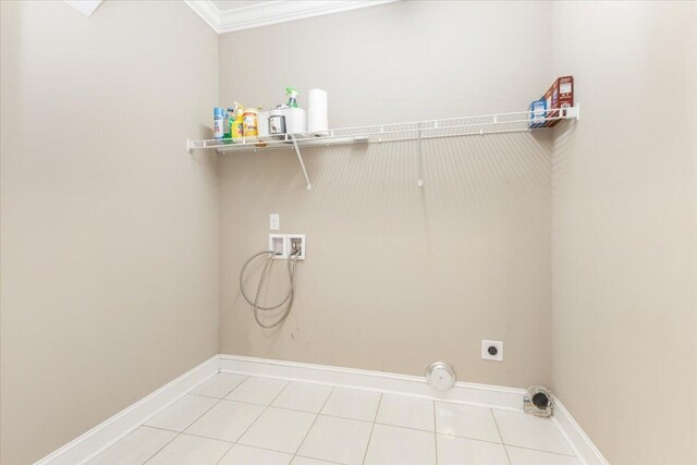 clothes washing area featuring baseboards, light tile patterned floors, laundry area, hookup for a washing machine, and hookup for an electric dryer