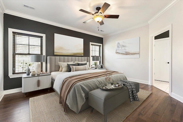 bedroom featuring crown molding, multiple windows, and dark wood-style flooring