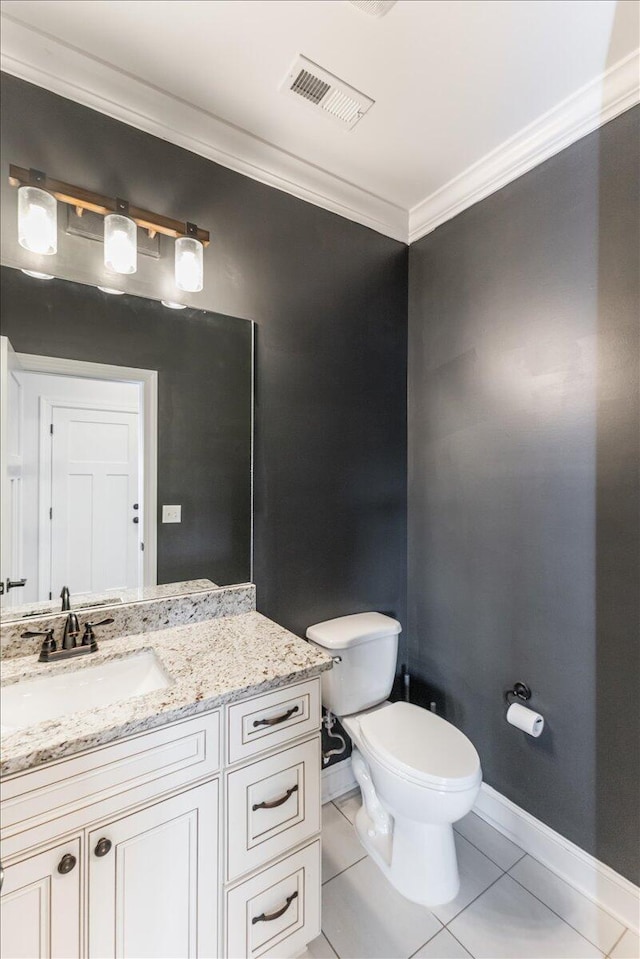 bathroom with tile patterned floors, visible vents, toilet, crown molding, and vanity