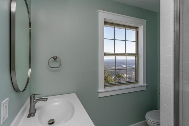 full bath with a sink and toilet