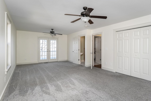 unfurnished bedroom featuring french doors, carpet floors, baseboards, and a ceiling fan