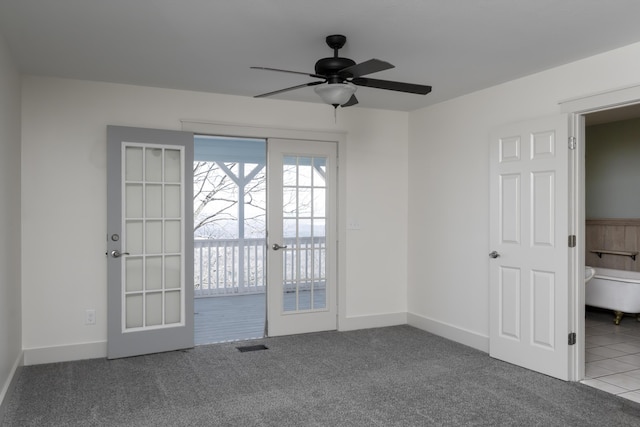 spare room with carpet flooring, french doors, baseboards, and ceiling fan