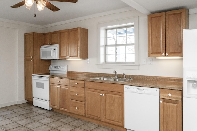 kitchen with a sink, white appliances, brown cabinetry, crown molding, and ceiling fan