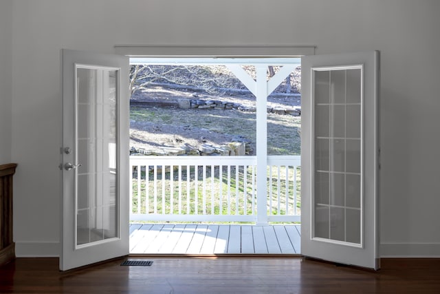 doorway featuring visible vents and wood finished floors