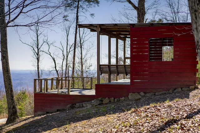 view of home's exterior featuring an outdoor structure