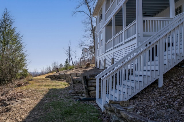 view of property exterior with stairway