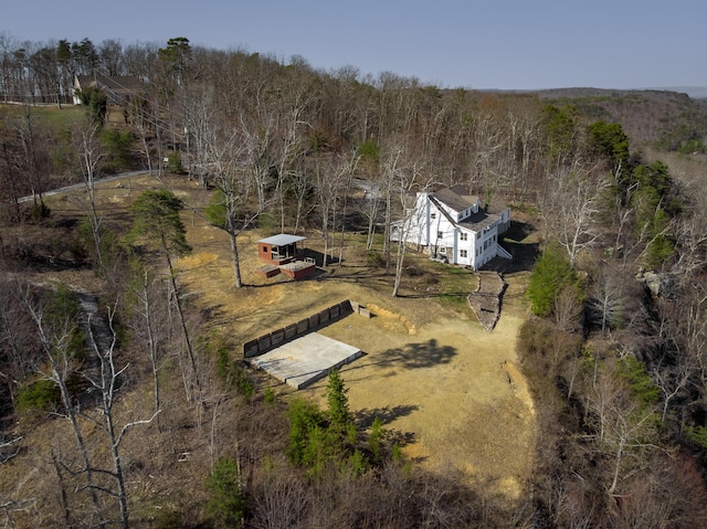 aerial view featuring a wooded view