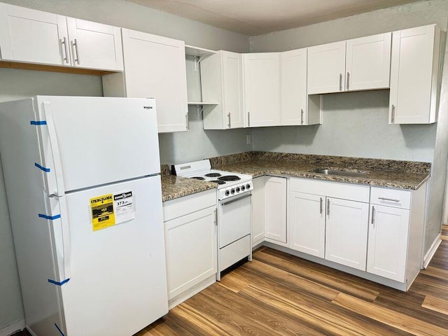 kitchen with dark wood-type flooring, white appliances, white cabinetry, and a sink