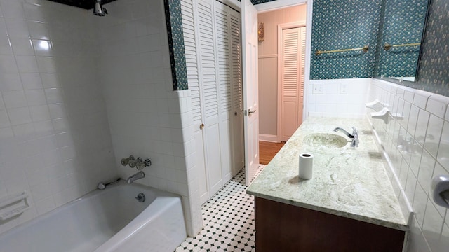 full bath with shower / tub combination, a closet, and vanity