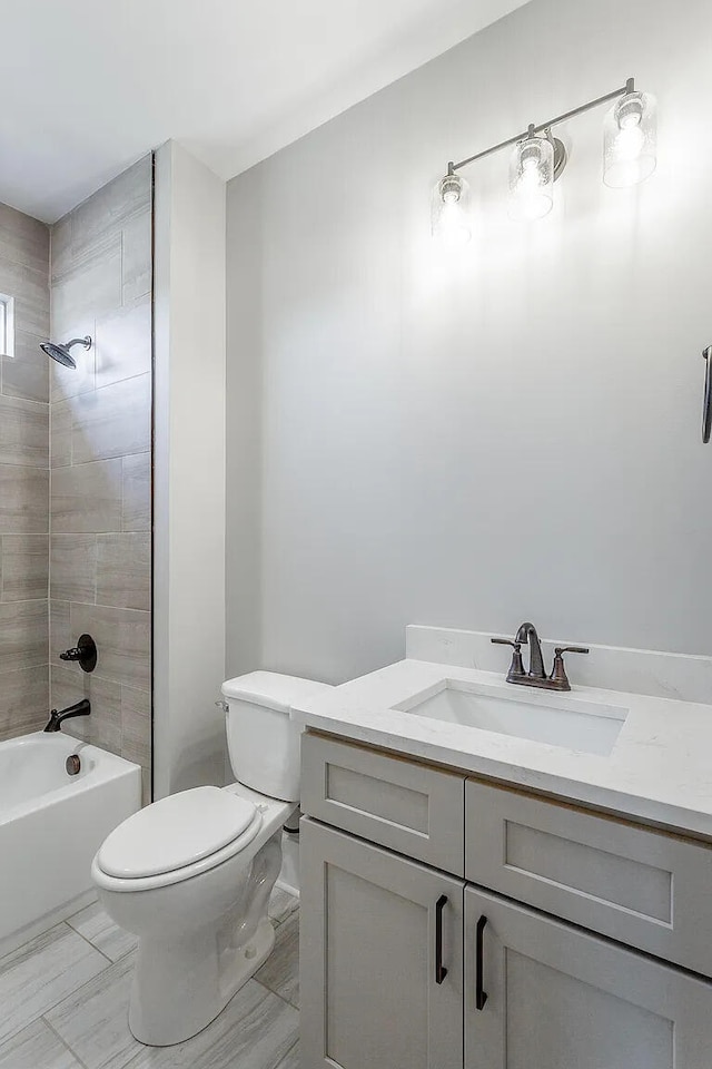 full bathroom with toilet, washtub / shower combination, and vanity