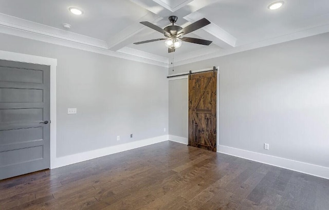 spare room featuring ceiling fan, a barn door, baseboards, beam ceiling, and dark wood finished floors