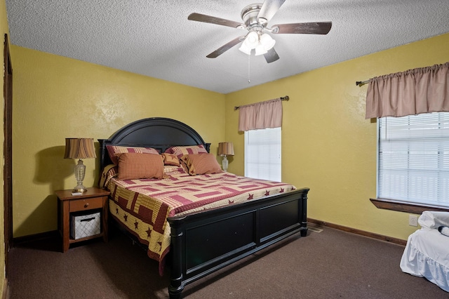 bedroom with baseboards, a textured wall, ceiling fan, a textured ceiling, and carpet flooring