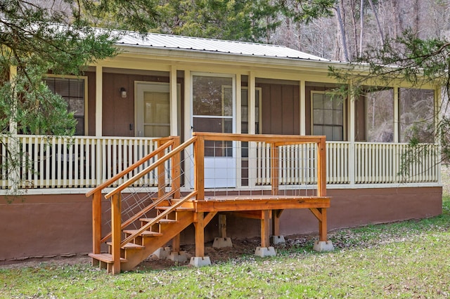 exterior space featuring covered porch and stairs