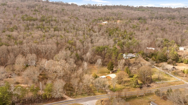 drone / aerial view featuring a forest view