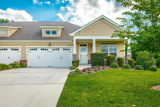 4581 Sweet Berry Ln, Ooltewah, TN 37363 - craftsman-style home featuring roof with shingles, a garage, driveway, a front yard, and stone siding