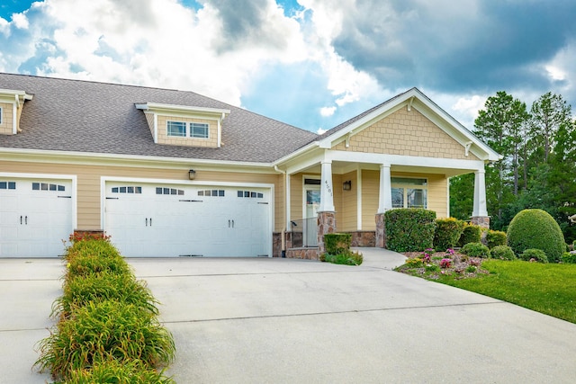 4581 Sweet Berry Ln, Ooltewah, TN 37363 - craftsman inspired home with driveway, a garage, a porch, roof with shingles, and stone siding