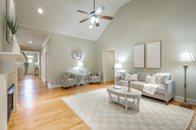 4581 Sweet Berry Ln, Ooltewah, TN 37363 - living room featuring ceiling fan, a fireplace, high vaulted ceiling, light wood-style flooring, and recessed lighting