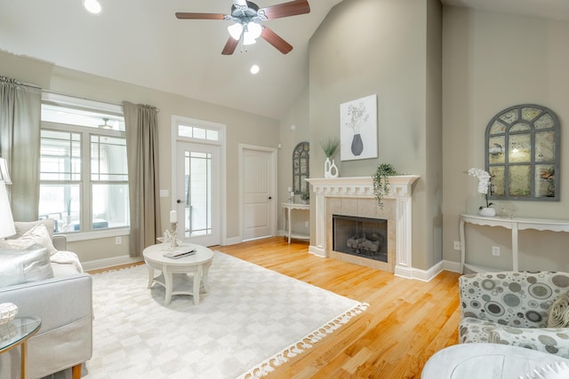 4581 Sweet Berry Ln, Ooltewah, TN 37363 - living room with high vaulted ceiling, ceiling fan, wood finished floors, a fireplace, and recessed lighting